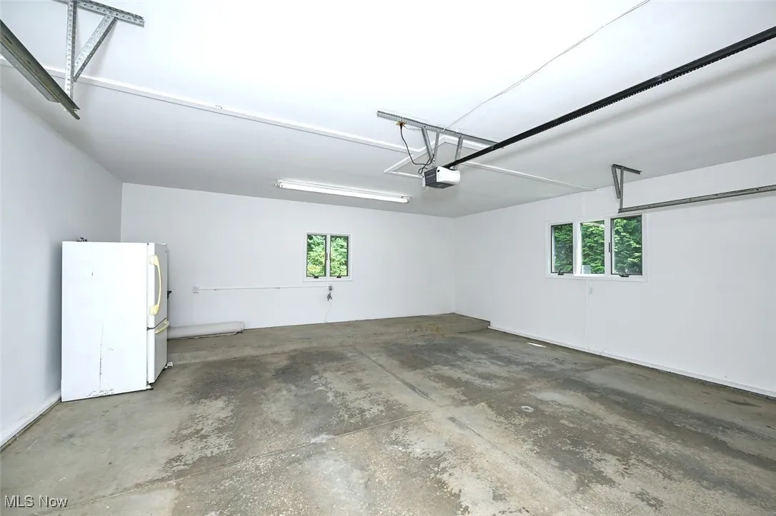 *GARAGE W/OPENER & RAISED AREA BEHIND FOR BIKES! ~