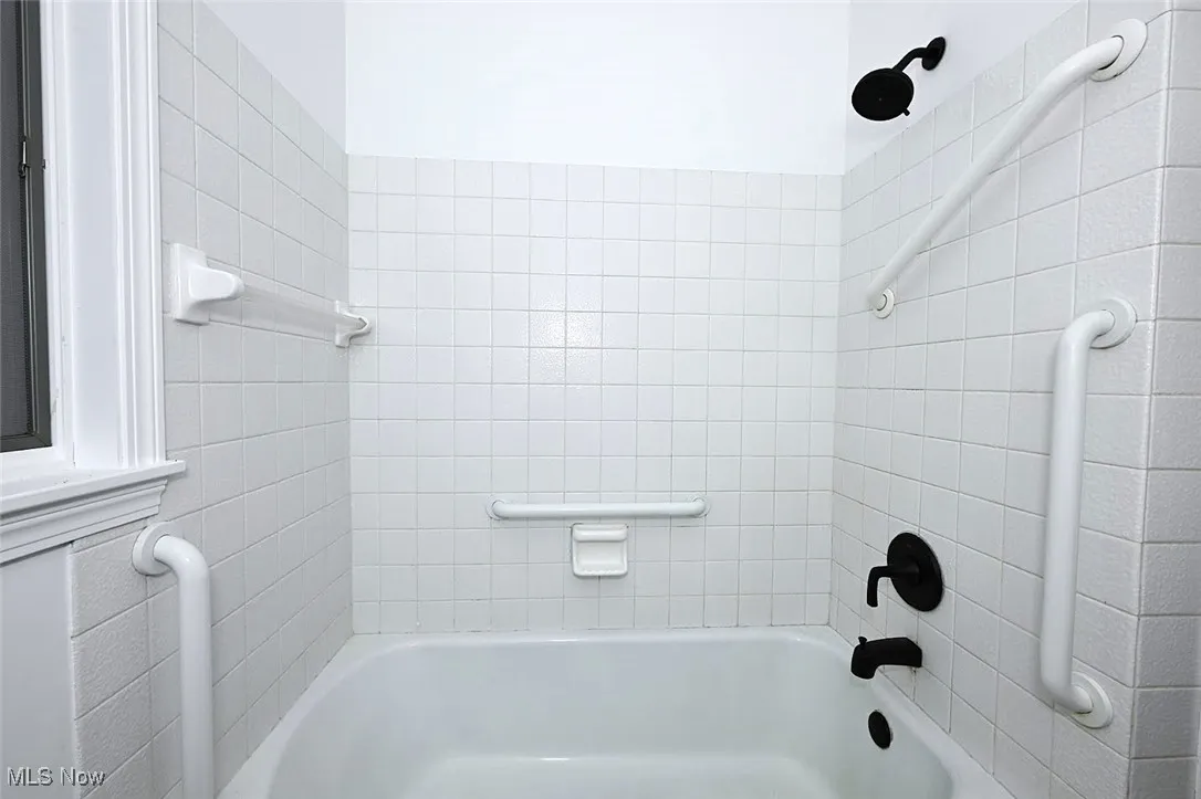 *BATHROOM W/WHITE VANITY, LINEN CLOSET, BLACK ACCENT HARDWARE AND PFISTER FAUCET, MIRROR AND DOUBLE LIGHTING SCONCE, TUB AND SHOWER, LUXURY PLANK FLOORING ~