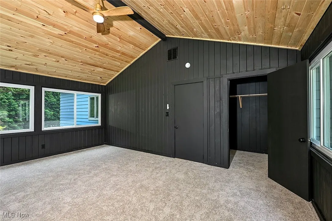 *LARGE MASTER BEDROOM RETREAT SITS ON IT'S OWN SIDE OF HOME WITH NEW SOFT CARPET, BEAMED VAULTED CEILING, CEILING FAN W/REMOTE AND LIGHT, KNOTTY PINE CEILING, HEATED AND COOLED. ADD YOUR OWN SHADES TO THE WINDOWS LIKE ANY BEDROOM FOR PRIVACY AND DARKNESS. SUPER COOL TO HAVE A BEDROOM LIKE THIS ~