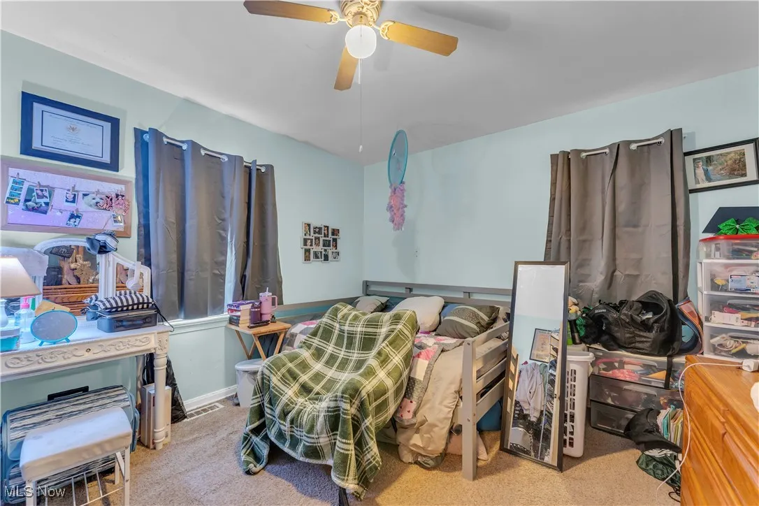 Bedroom featuring carpet and a ceiling fan