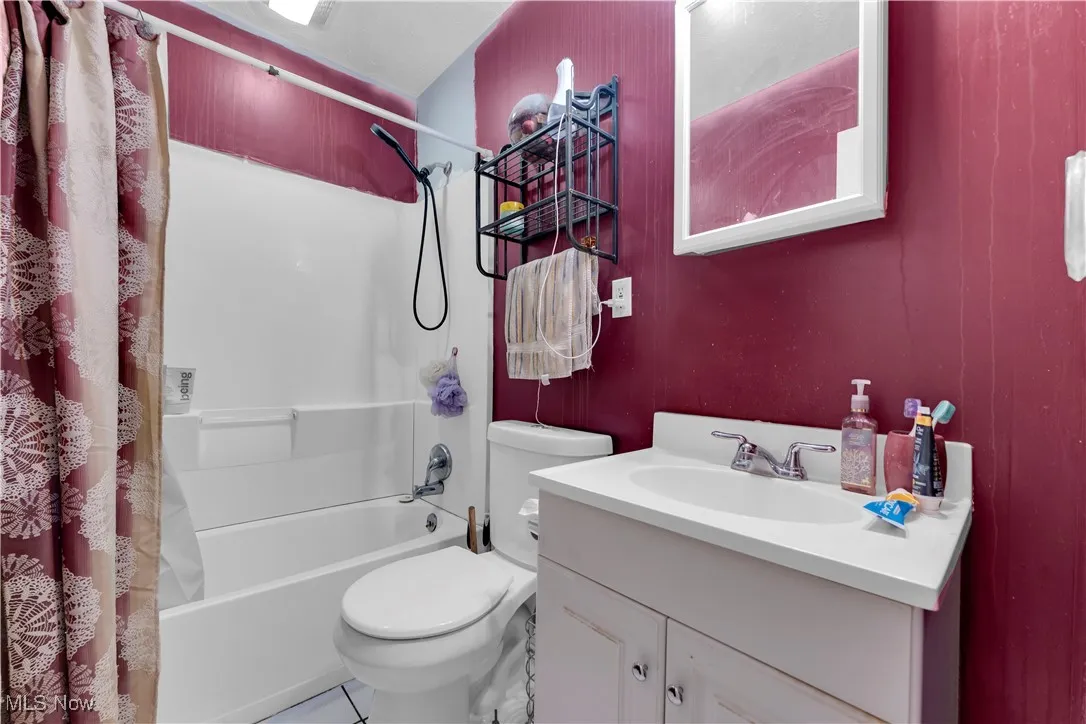 Bathroom with tile patterned flooring and vanity