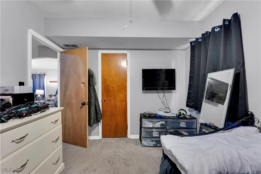 Bedroom featuring carpet and a ceiling fan