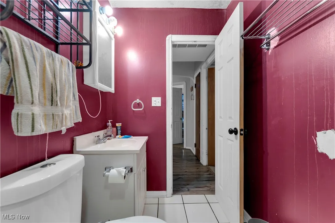 Carpeted bedroom featuring baseboards and ceiling fan