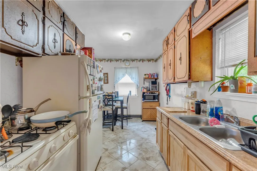 Utilities with water heater, separate washer and dryer, and heating unit