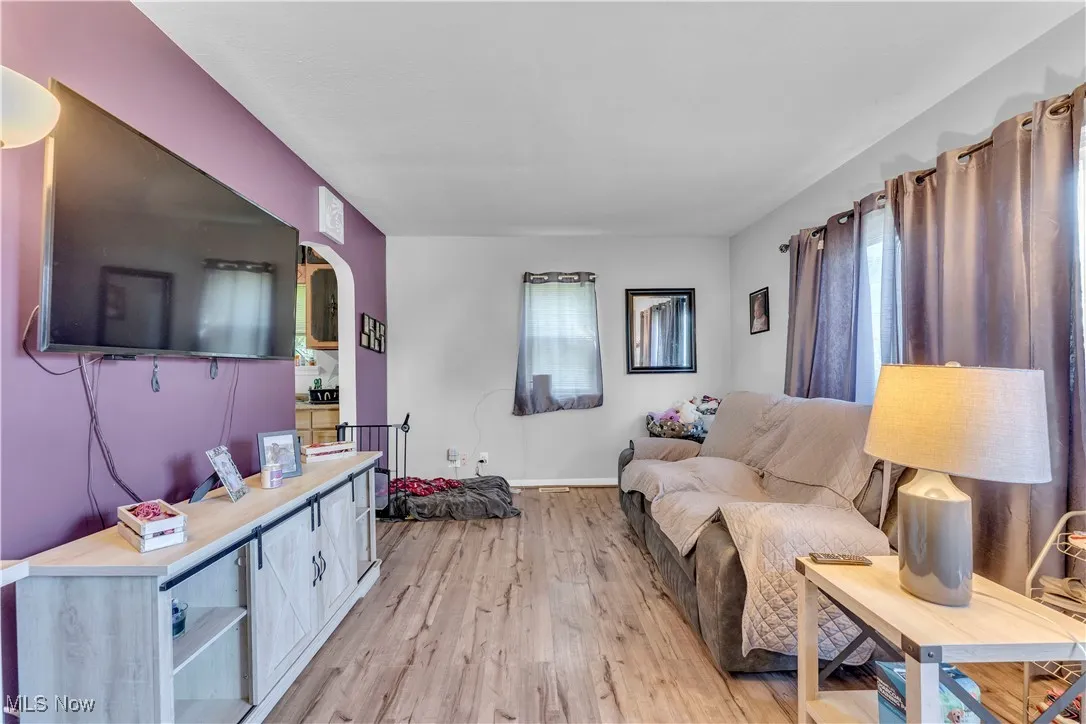Living area featuring wood finished floors and baseboards