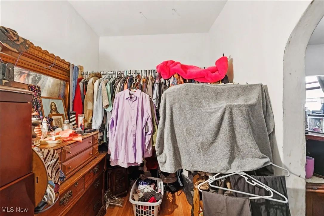 Spacious closet featuring wood finished floors