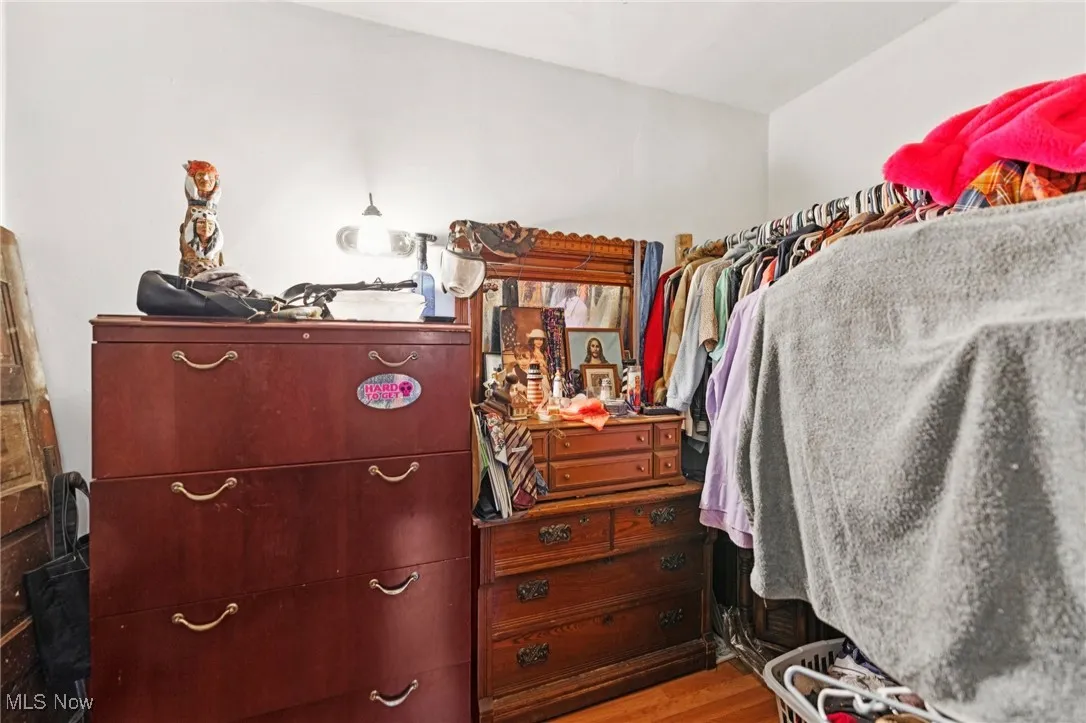 Walk in closet featuring wood finished floors