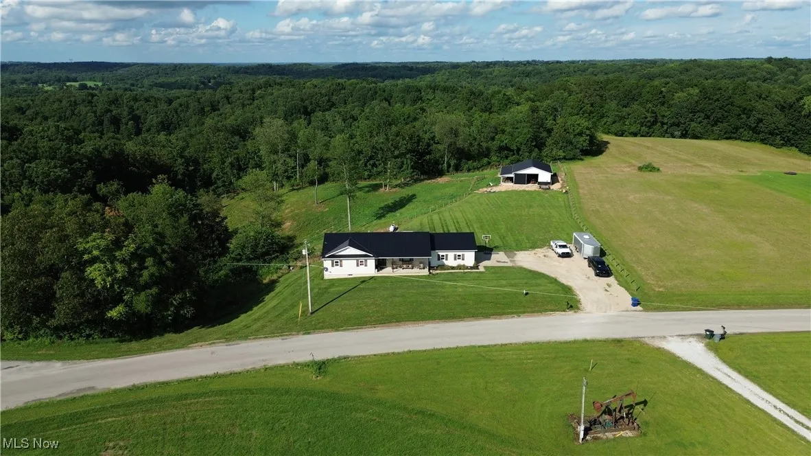 View of rural area featuring a heavily wooded area