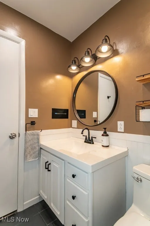 Bathroom featuring vanity and tile patterned flooring