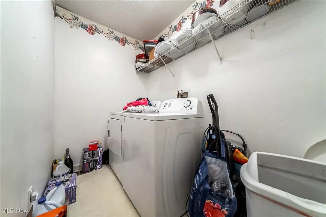 Laundry area with washer and clothes dryer