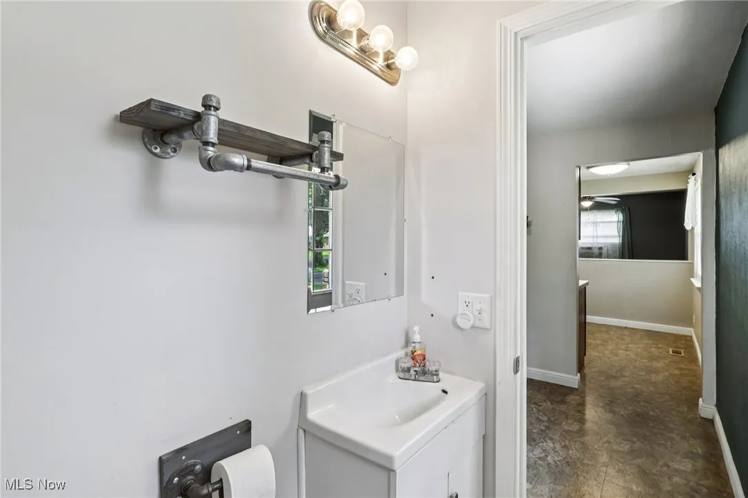Bathroom featuring healthy amount of natural light and vanity