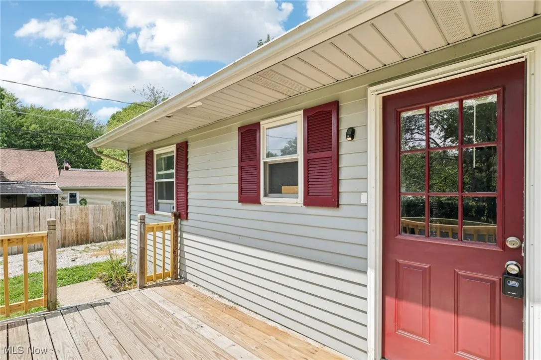 Entrance to property with a wooden deck