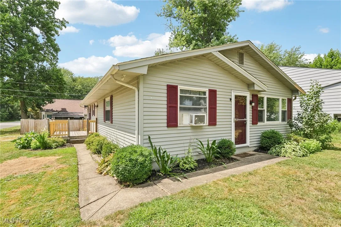 Bungalow-style home with a front lawn