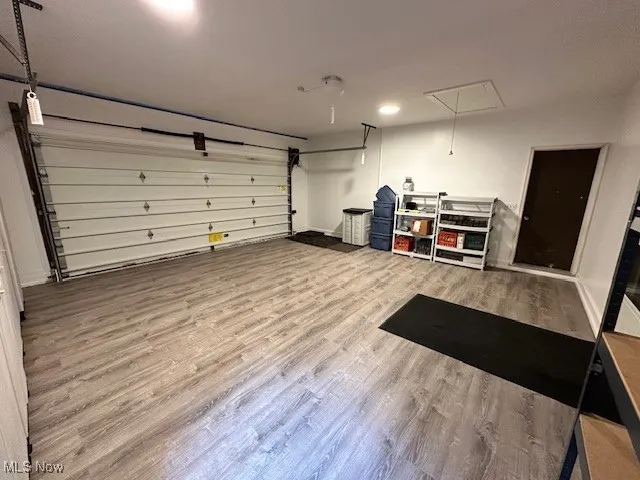 Garage featuring baseboards