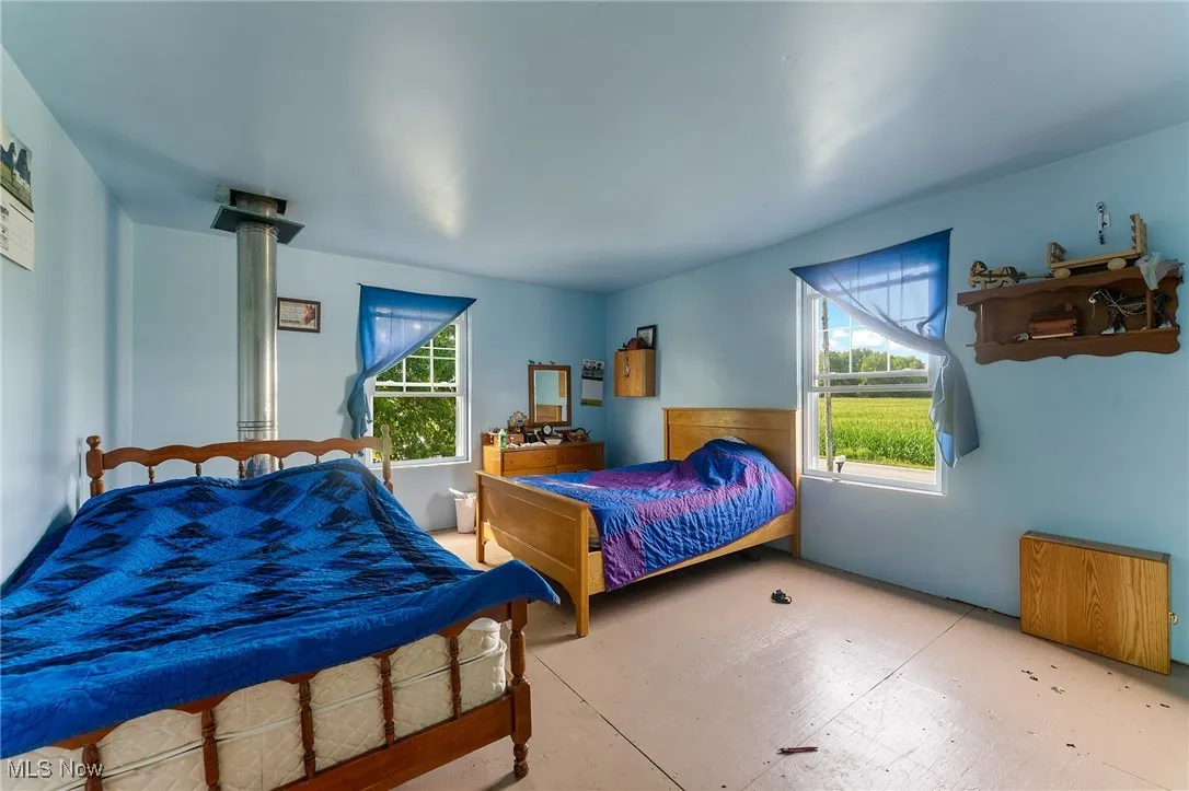 Bedroom with multiple windows