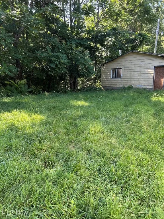 View of yard featuring view of scattered trees