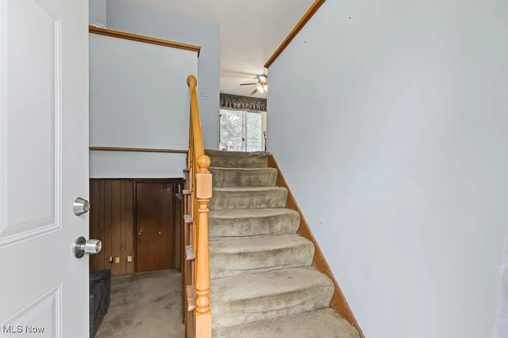 Staircase with a ceiling fan