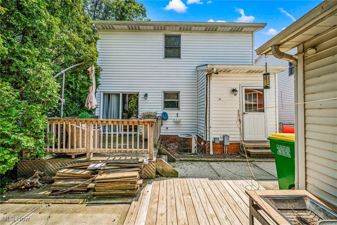 Back of property with a deck