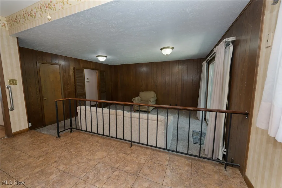 View from kitchen overlooking the family room and the doorway that leads into the main hallway