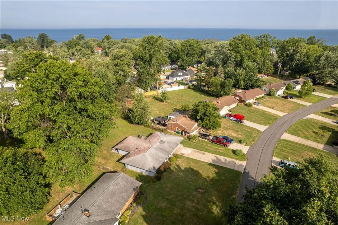Aerial perspective of suburban area featuring a nearby Lake Erie