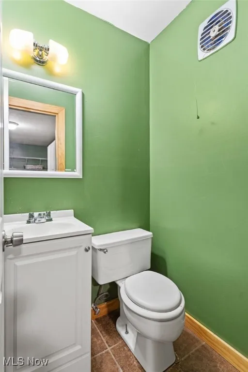 Bathroom with tile patterned flooring and vanity