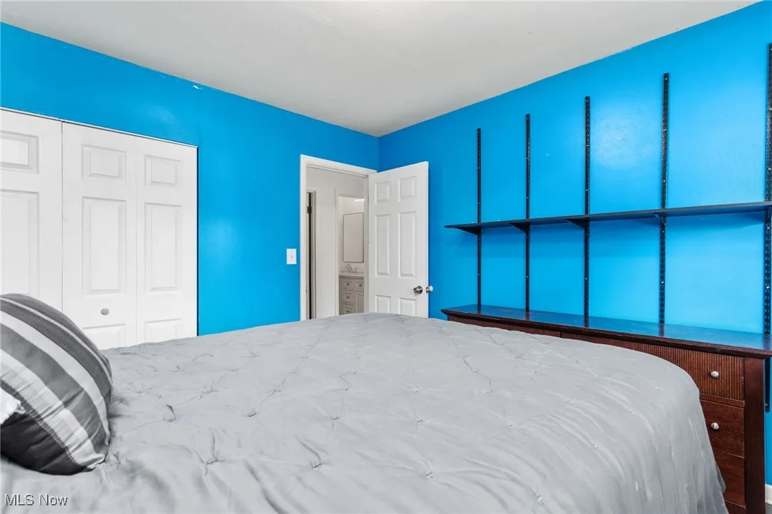 Bedroom with laminate flooring.