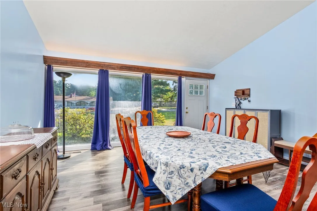 Dining space featuring a healthy amount of natural light, and vaulted ceiling
