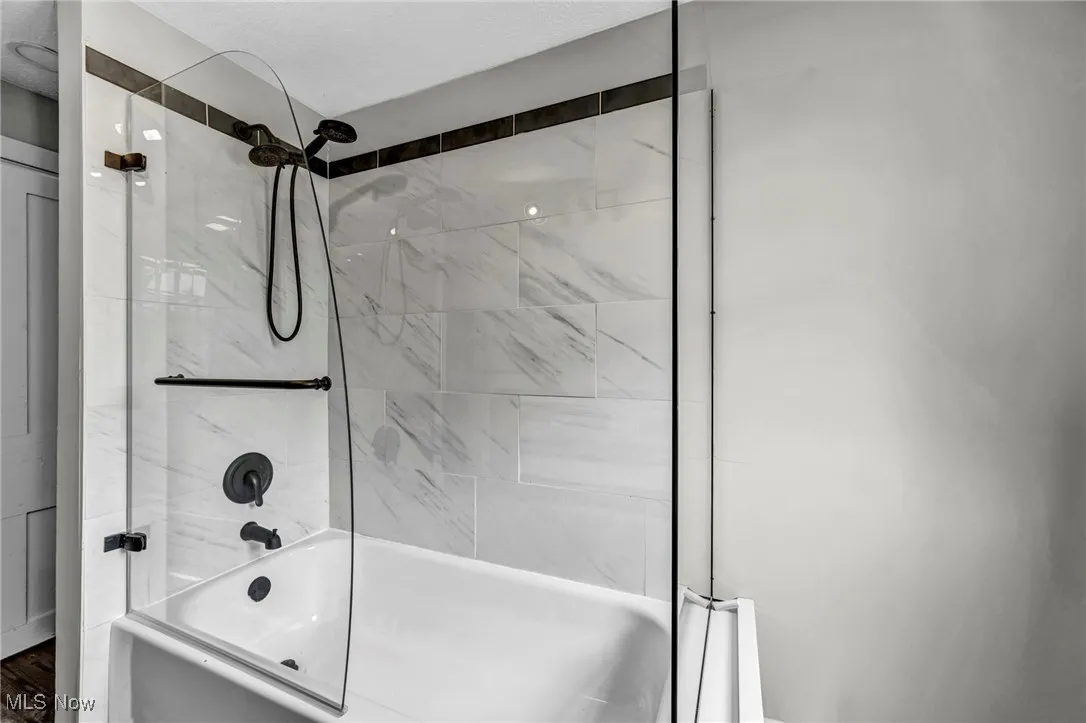 Full bath featuring shower / bathtub combination