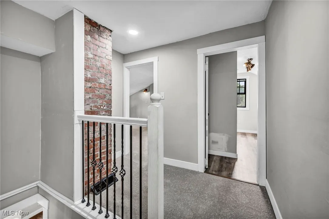Upstairs Hallway featuring carpet and an upstairs landing