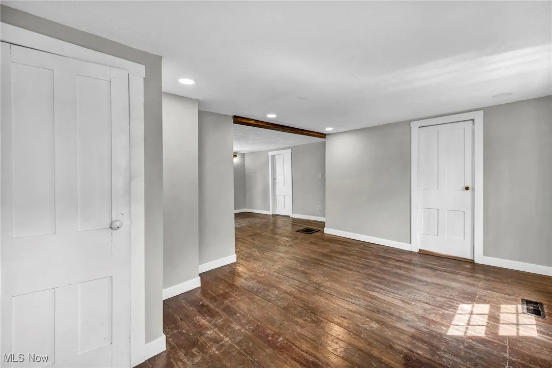 Empty room featuring hardwood / wood-style flooring, recessed lighting, and a textured ceiling