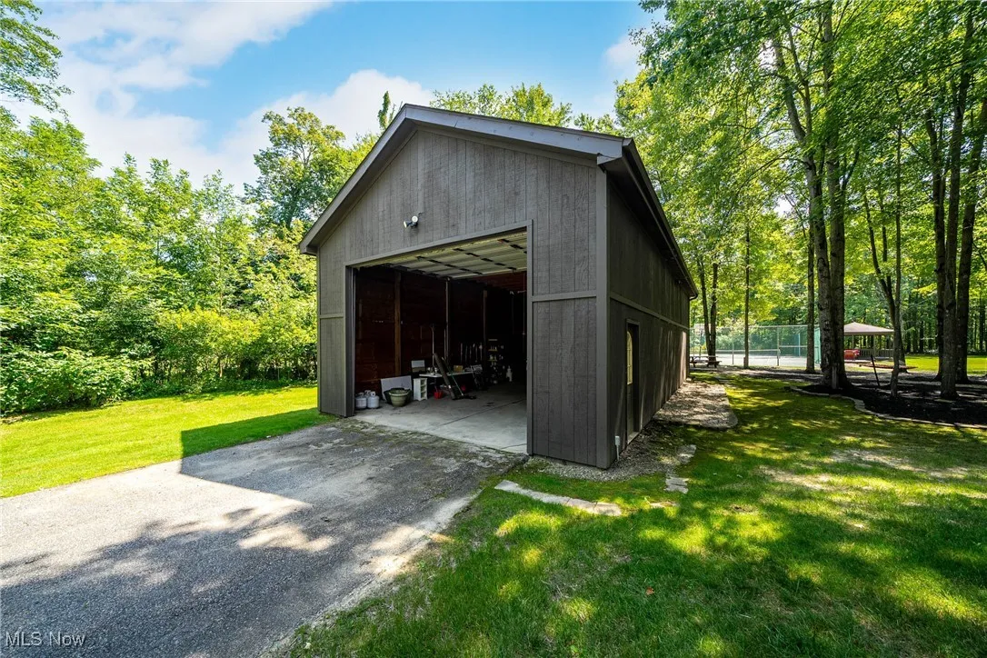 Detached outbuilding can be used for extra vehicles, outdoor parties, or can possibly become a carriage house.  Can be used in many ways!