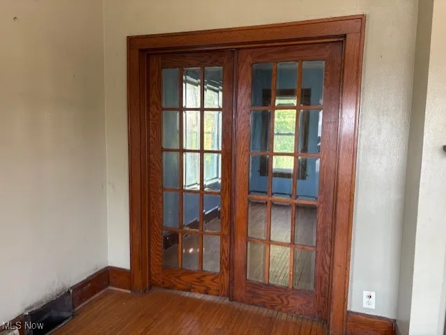 Detailed view of wood finished floors and french doors