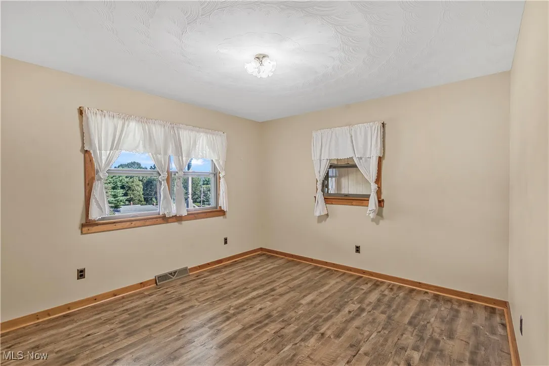 Empty room with wood finished floors