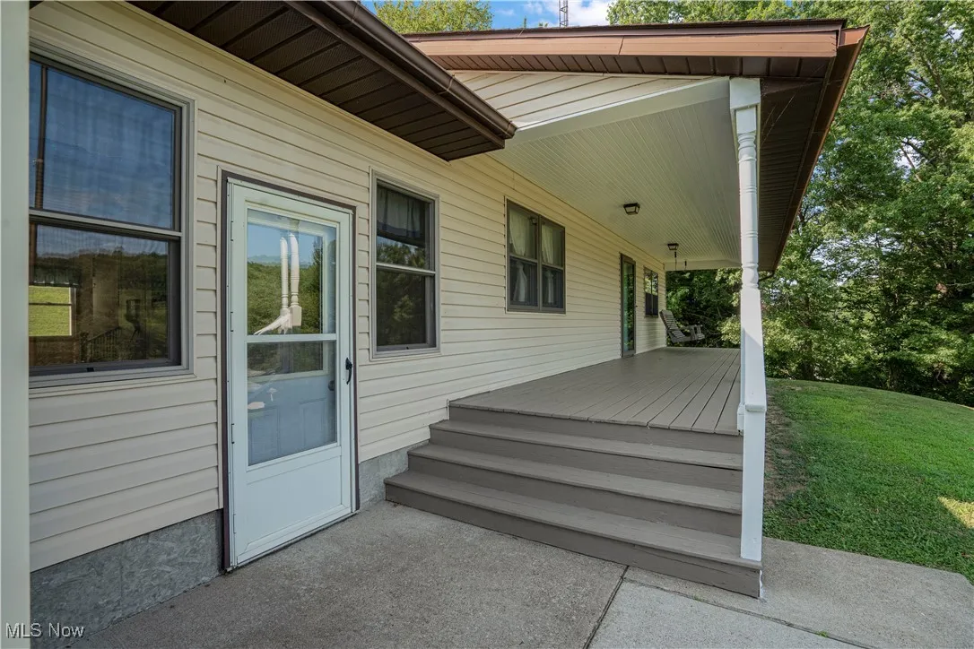 Wooden deck featuring a yard