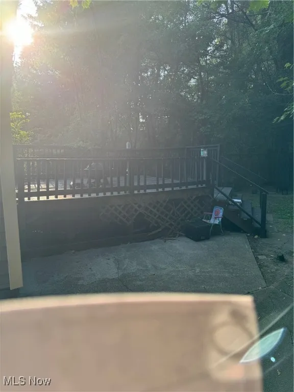 View of swimming pool with a wooden deck