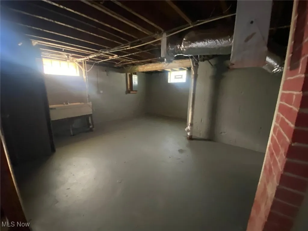 Basement featuring a sink