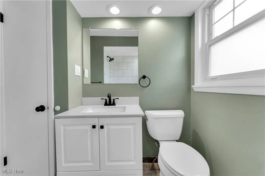 Bathroom featuring vanity and a shower