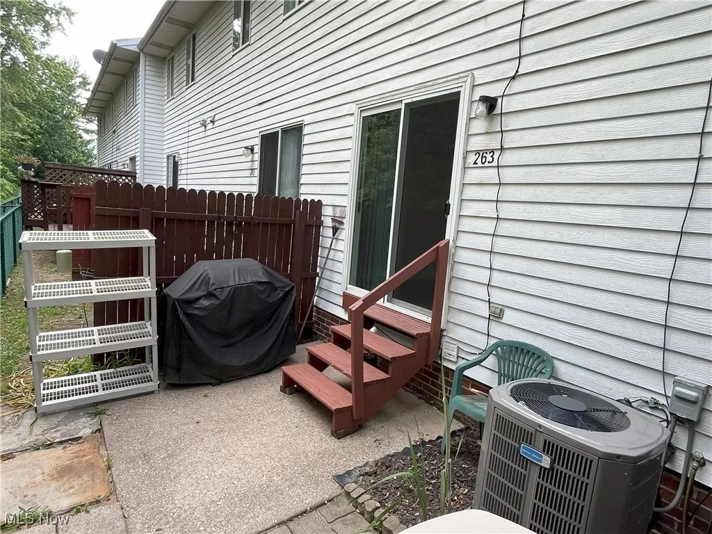 View of patio featuring entry steps and grilling area