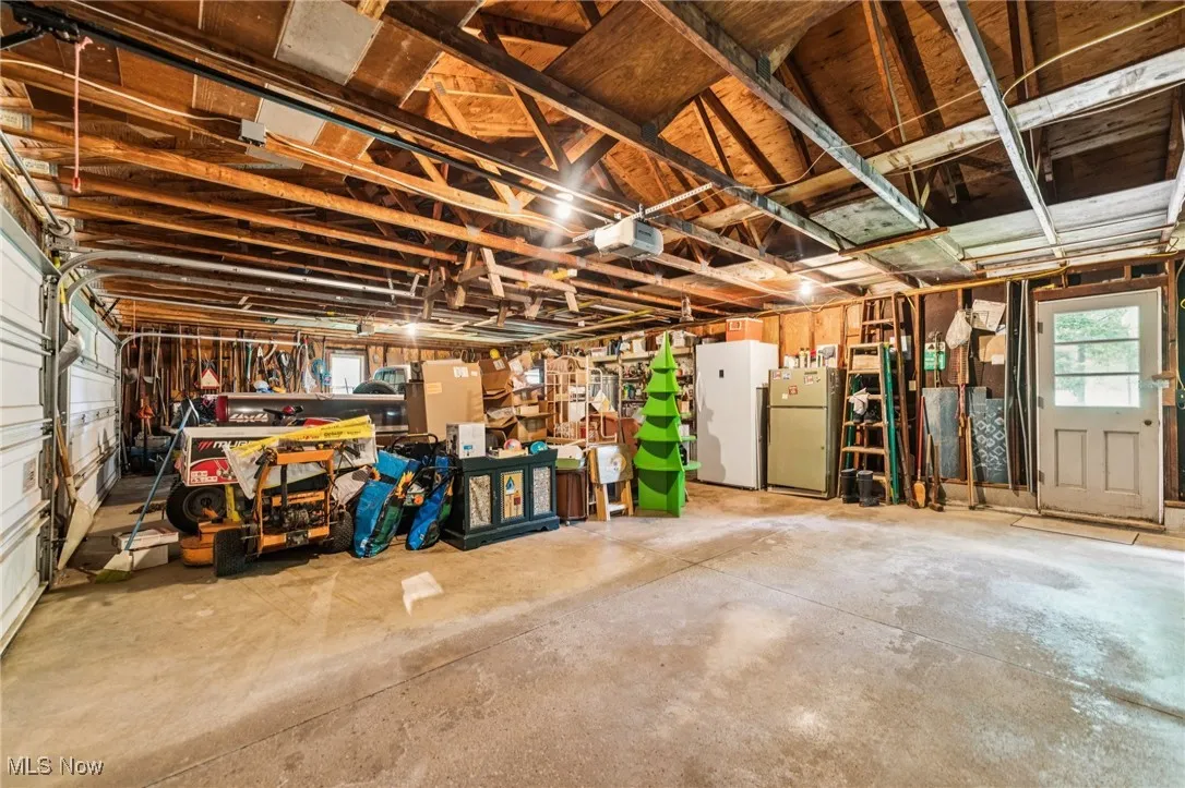 Garage with freestanding refrigerator