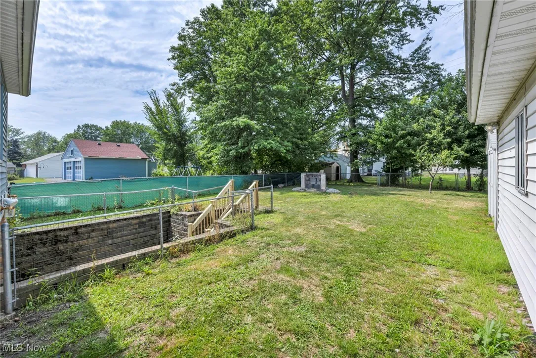 View of fenced backyard