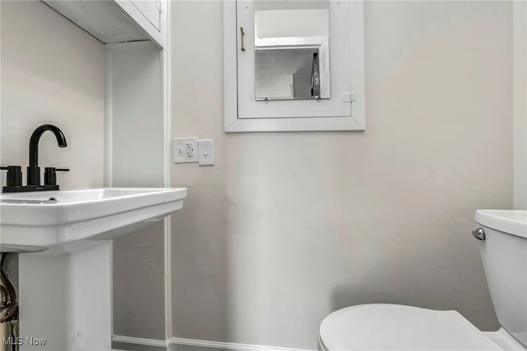 Half bathroom featuring toilet