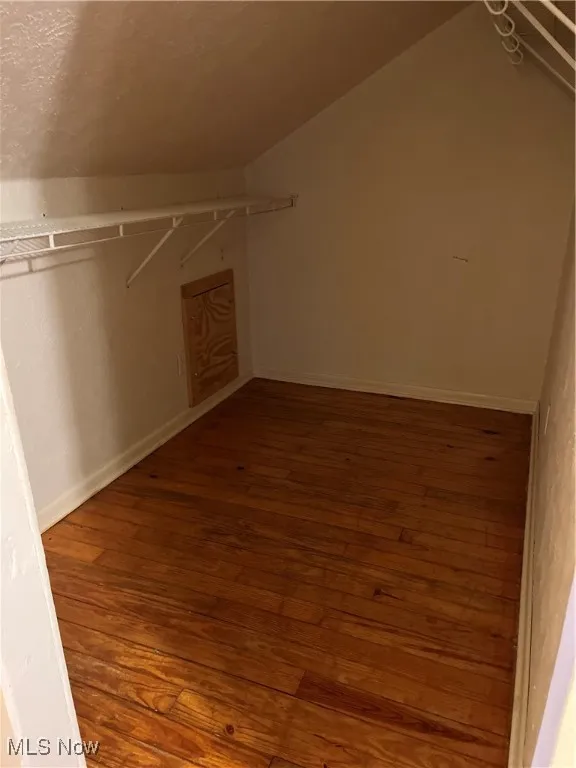 2nd floor master bedroom - Spacious closet featuring wood-type Closet-flooring and vaulted ceiling