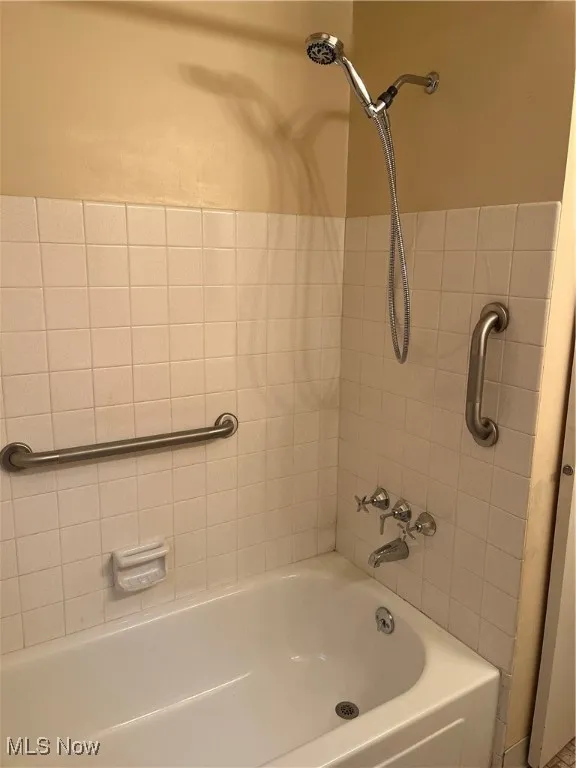 Bathroom featuring  shower combination