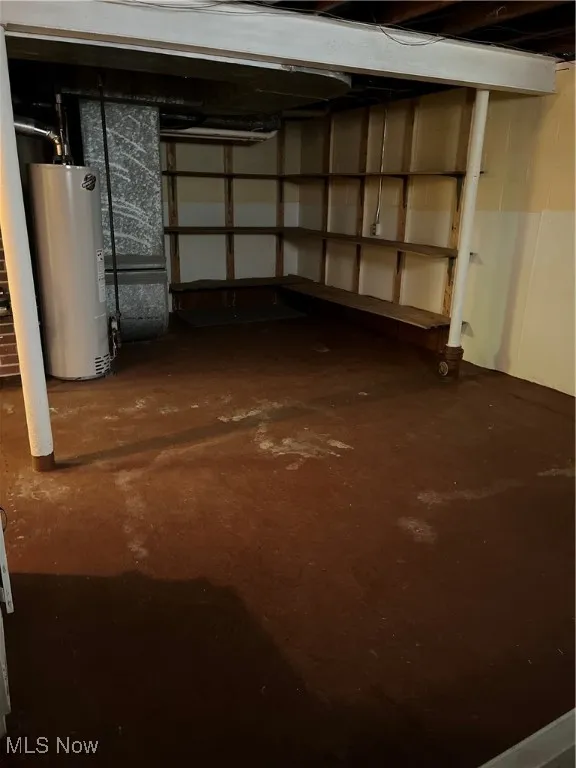 Unfinished area of basement with water heater