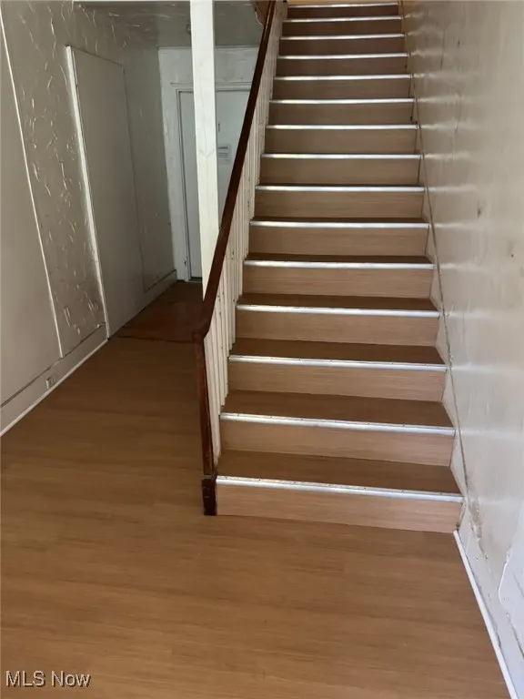 Stairway featuring new LVT flooring