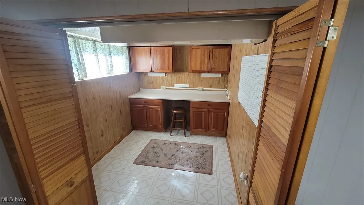 countertops, and brown cabinetry