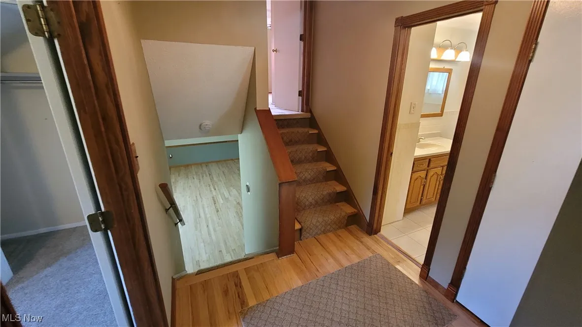Staircase with wood finished floors