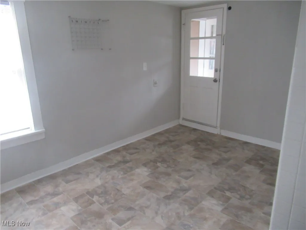 Unfurnished room with healthy amount of natural light
