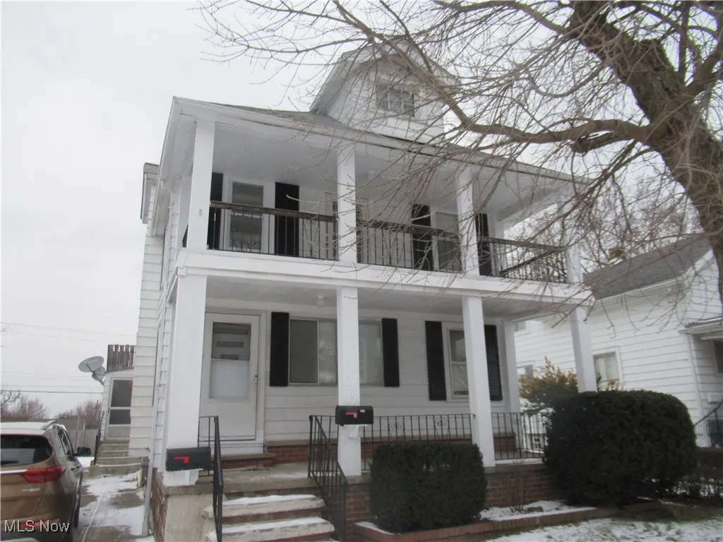 Greek revival inspired property featuring covered porch