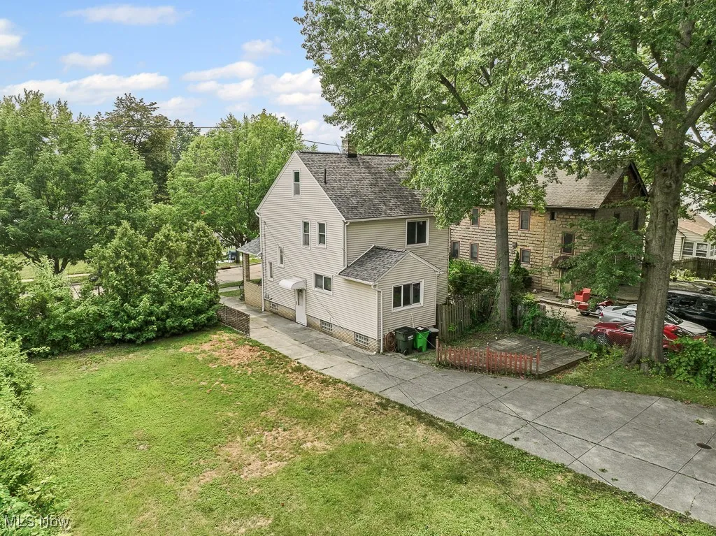 Aerial view of the home with 1 of 2 vacant lots attached